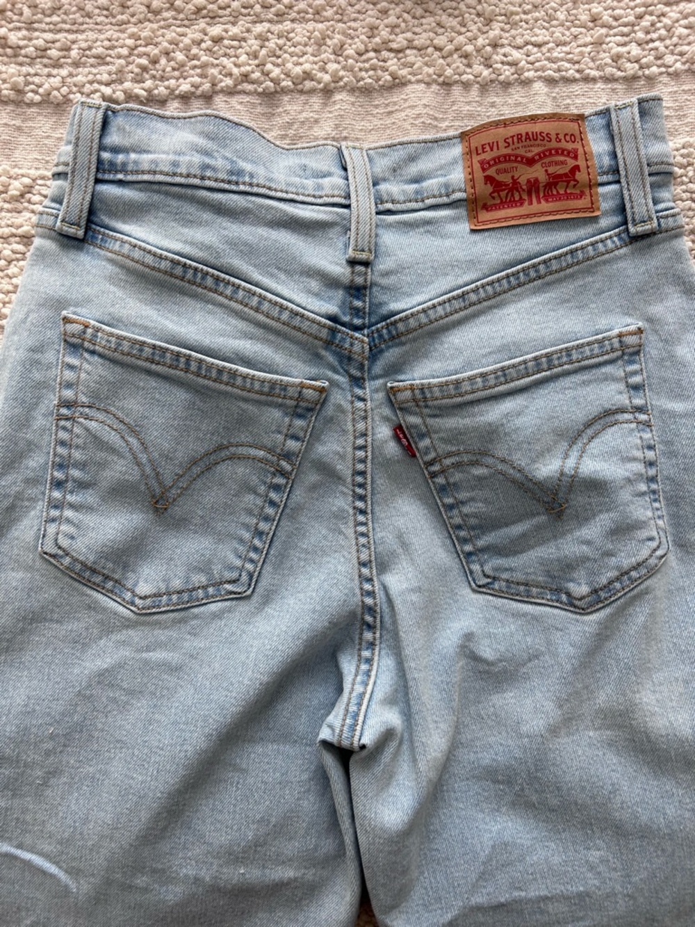Levi's Light Blue High-Rise Rib Cage Women's Jeans - Classic Back Pocket Detail